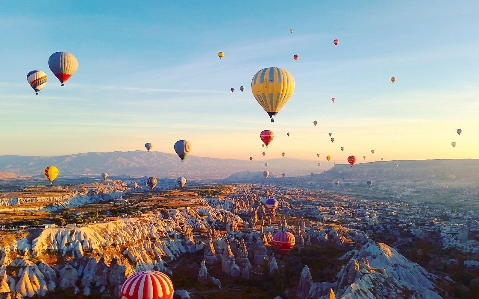 Hot air balloons over the valleys of Cappadocia